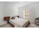 Bedroom with light bedding and wood platform bed at 236 Denali St, Haines City, FL 33844