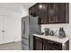 Well-equipped kitchen with dark cabinetry and ample counter space at 236 Denali St, Haines City, FL 33844