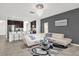 Spacious living area featuring a comfy sectional sofa and large TV at 236 Denali St, Haines City, FL 33844