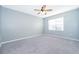 Spacious bedroom with carpeted floor and ceiling fan at 441 Tallow Wood Cir, Debary, FL 32713