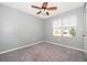 Bright bedroom with carpeted floor and window at 441 Tallow Wood Cir, Debary, FL 32713
