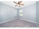 Well-lit bedroom with ceiling fan and carpet at 441 Tallow Wood Cir, Debary, FL 32713