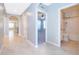 Bright hallway with tile floors and archways leading to other rooms at 441 Tallow Wood Cir, Debary, FL 32713