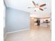 Living area with tile floors and kitchen view at 441 Tallow Wood Cir, Debary, FL 32713