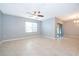 Living room with tile floor, ceiling fan, and sliding door at 441 Tallow Wood Cir, Debary, FL 32713