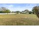 Large backyard with green grass and a view of the house at 4835 Citrus Oak Ln, Saint Cloud, FL 34771