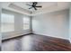 Spacious bedroom with dark hardwood floors and ceiling fan at 8976 Hildreth Ave, Orlando, FL 32832