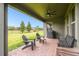 Covered patio with seating and ceiling fan at 9482 Bolero Rd, Winter Garden, FL 34787