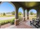 Front porch with arched entryway and view of neighborhood at 9482 Bolero Rd, Winter Garden, FL 34787