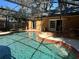 Inviting pool area with screened enclosure, brick coping, and adjacent patio at 956 Bucksaw Pl, Longwood, FL 32750