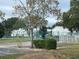 Community tennis courts surrounded by trees and townhomes at 5363 Skelly Sq # 1005, Orlando, FL 32812