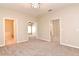 Main bedroom with bathroom access and mirrored closet doors at 1205 Longville Cir, Tavares, FL 32778