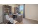 Home office with a large desk, two chairs, and built-in shelving at 1292 Hanoverian Dr, Lake Alfred, FL 33850