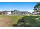 Large backyard with home and screened porch visible at 2588 Sun Acres Blvd, Auburndale, FL 33823