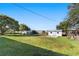 Large backyard with grassy area and storage shed at 2588 Sun Acres Blvd, Auburndale, FL 33823
