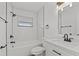 Modern bathroom with subway tile and updated vanity at 2588 Sun Acres Blvd, Auburndale, FL 33823