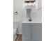 Updated bathroom, gray vanity, and modern fixtures at 2588 Sun Acres Blvd, Auburndale, FL 33823
