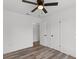 Bright bedroom with ceiling fan and wood-look floors at 2588 Sun Acres Blvd, Auburndale, FL 33823