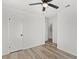 Bright bedroom with ceiling fan and wood-look floors at 2588 Sun Acres Blvd, Auburndale, FL 33823