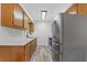 Kitchen boasts wood cabinets, stainless steel appliances, and quartz countertops at 2588 Sun Acres Blvd, Auburndale, FL 33823