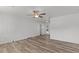 Bright living room featuring hardwood floors and a ceiling fan at 2588 Sun Acres Blvd, Auburndale, FL 33823