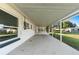 Covered patio with access to backyard and screened enclosure at 2588 Sun Acres Blvd, Auburndale, FL 33823