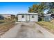 White storage shed with green trim at 2588 Sun Acres Blvd, Auburndale, FL 33823
