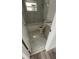 Updated bathroom with white vanity, toilet, and marble-look flooring at 26221 Se 159Th Ln, Umatilla, FL 32784
