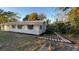 Side view of the house, showcasing landscaping and walkway at 26221 Se 159Th Ln, Umatilla, FL 32784