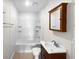 Clean bathroom with a shower/tub combo and wood vanity at 3334 Mount Tabor Rd, Lakeland, FL 33810
