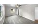 Bright bedroom featuring carpet, a ceiling fan, and a window at 3334 Mount Tabor Rd, Lakeland, FL 33810
