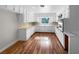 Well-equipped kitchen boasting white cabinets and wood flooring at 3334 Mount Tabor Rd, Lakeland, FL 33810