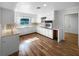 Efficient kitchen featuring white cabinetry and wood flooring at 3334 Mount Tabor Rd, Lakeland, FL 33810