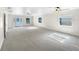 Spacious living room featuring light gray carpeting and lots of natural light at 3334 Mount Tabor Rd, Lakeland, FL 33810