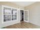 Spacious balcony with wood-look flooring and access to the living area through French doors at 3725 Conroy Rd # 2131, Orlando, FL 32839