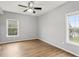 Bright bedroom with two windows and ceiling fan at 3725 Conroy Rd # 2131, Orlando, FL 32839
