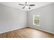 Bright bedroom with wood-look floors and a ceiling fan at 3725 Conroy Rd # 2131, Orlando, FL 32839