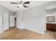 Bedroom with wood-look floors and access to bathroom at 3725 Conroy Rd # 2131, Orlando, FL 32839