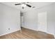 Spacious bedroom with wood-look floors and ceiling fan at 3725 Conroy Rd # 2131, Orlando, FL 32839