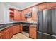 Modern kitchen featuring wood cabinets and granite countertops at 3725 Conroy Rd # 2131, Orlando, FL 32839