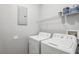 In-unit laundry with white washer and dryer at 3725 Conroy Rd # 2131, Orlando, FL 32839