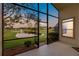 Relaxing screened patio overlooking a pond and fountain at 480 Arrowmount Pl, Lake Mary, FL 32746