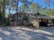 Two-story condo building with carport and private fenced yard at 5308 Pebble Beach Dr # F-01-1, Orlando, FL 32811