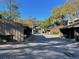 Community view of condo buildings with parking area at 5308 Pebble Beach Dr # F-01-1, Orlando, FL 32811