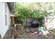 Small backyard with a grill and some debris at 5541 Fairfax St, Orlando, FL 32812