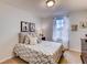 Well-lit bedroom with a patterned bedspread and tasteful decor at 6098 Galloping Dr, Apopka, FL 32712