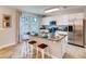 Modern kitchen with stainless steel appliances and granite countertops at 6098 Galloping Dr, Apopka, FL 32712