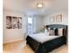 Cozy bedroom with a gray upholstered bed and window curtains at 6102 Galloping Dr, Apopka, FL 32712