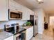 Modern kitchen with stainless steel appliances and granite countertops at 6102 Galloping Dr, Apopka, FL 32712