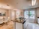 Modern kitchen with granite counters, stainless steel appliances and island at 6102 Galloping Dr, Apopka, FL 32712
